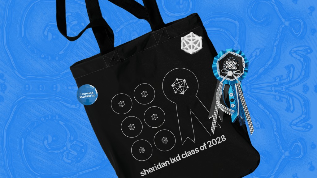 Black tote bag with IXD lattice icons, pin, and Best in Show ribbon